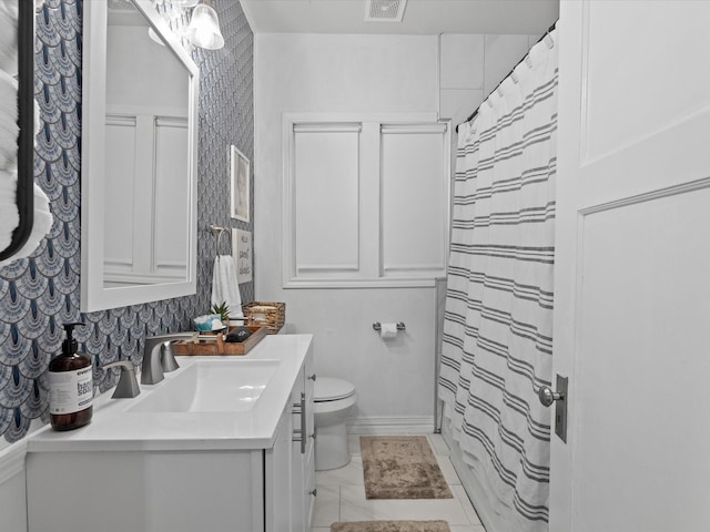 bathroom with vanity, visible vents, toilet, wallpapered walls, and a shower with curtain