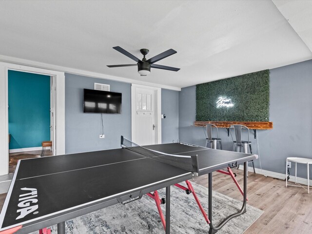 game room featuring baseboards, ceiling fan, wood finished floors, and visible vents