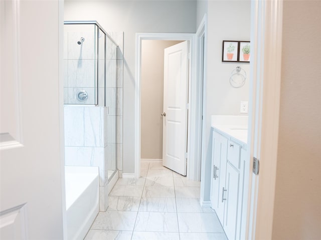 1714 Cecil Crest Ln, Forney, TX 75126 - bathroom featuring a bath, a shower stall, vanity, baseboards, and marble finish floor