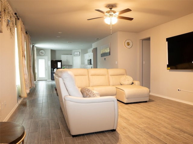 1714 Cecil Crest Ln, Forney, TX 75126 - living area featuring baseboards, ceiling fan, and wood finished floors