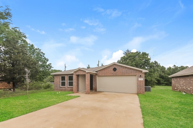 ranch-style house with brick siding, a garage, a front lawn, and driveway