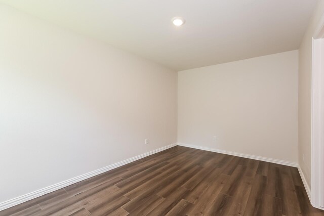 609 Sherman St, Waco, TX 76704 - empty room featuring recessed lighting, baseboards, and dark wood-type flooring