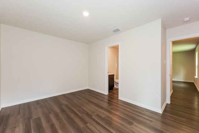 609 Sherman St, Waco, TX 76704 - spare room featuring recessed lighting, baseboards, visible vents, and dark wood-style floors