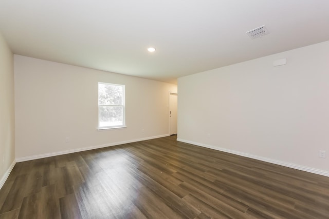 609 Sherman St, Waco, TX 76704 - unfurnished room with recessed lighting, baseboards, visible vents, and dark wood finished floors