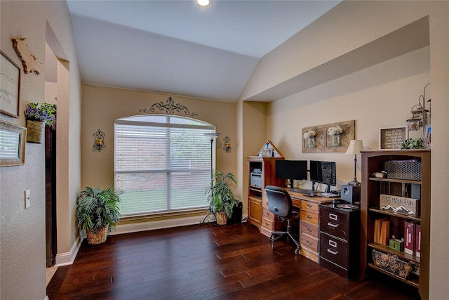 office area featuring dark wood-style flooring, baseboards, and vaulted ceiling