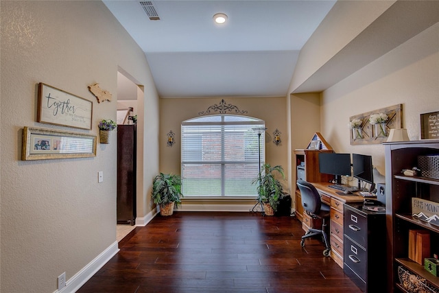 office area featuring dark wood-style flooring, baseboards, visible vents, and lofted ceiling
