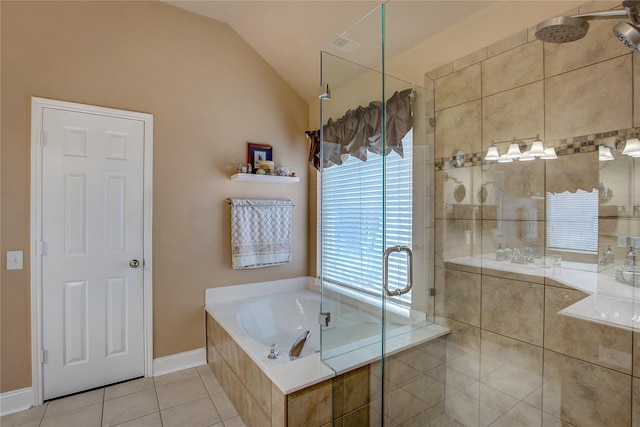 full bath with tile patterned floors, baseboards, a shower stall, vaulted ceiling, and a garden tub