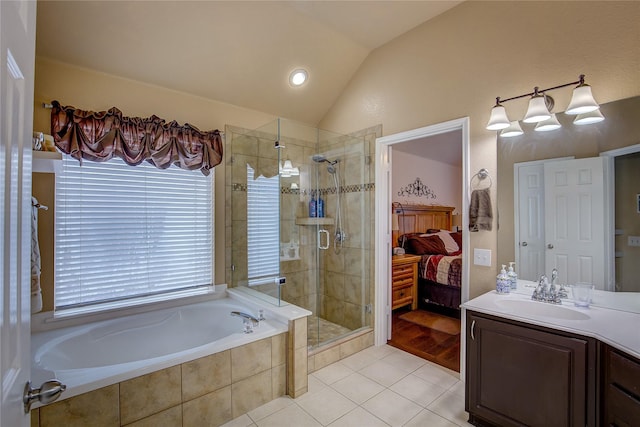 ensuite bathroom featuring a garden tub, lofted ceiling, ensuite bathroom, tile patterned floors, and a shower stall