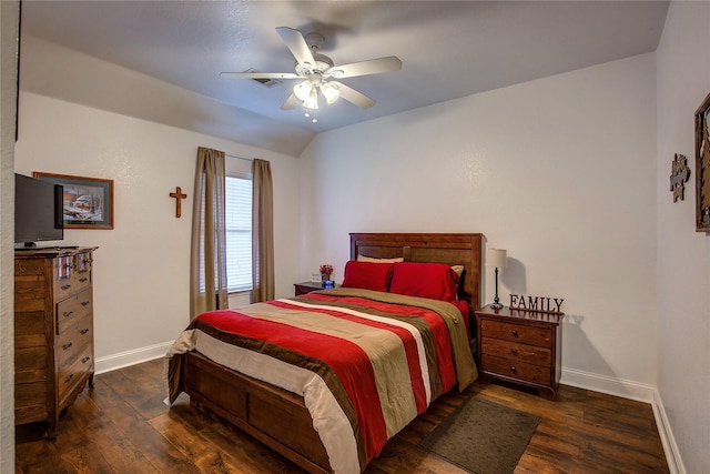 bedroom featuring baseboards, wood finished floors, and vaulted ceiling