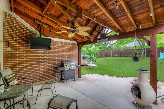 view of patio with grilling area, ceiling fan, and a fenced backyard