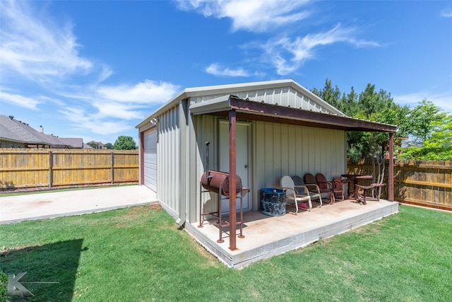 view of outdoor structure with a fenced backyard
