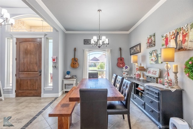 dining room featuring crown molding, baseboards, light tile patterned flooring, and a chandelier
