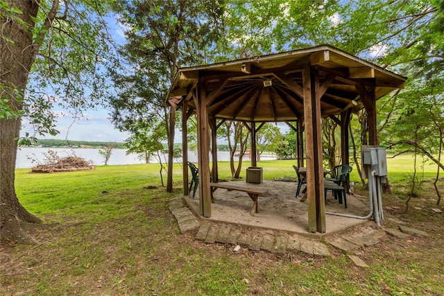 surrounding community featuring a yard, a water view, a gazebo, and a patio