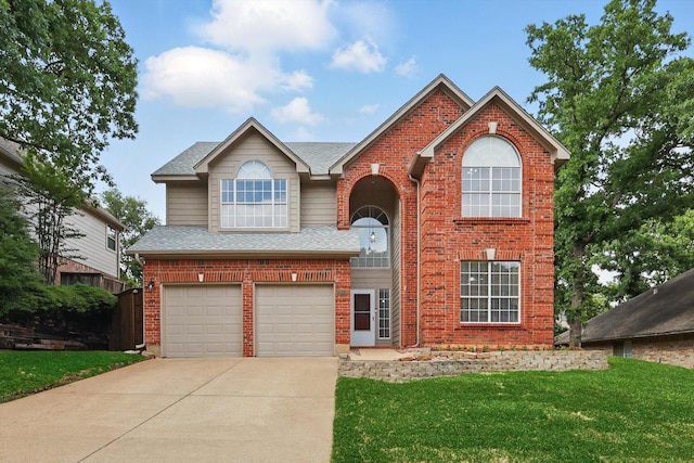 traditional-style home with roof with shingles, an attached garage, driveway, and brick siding