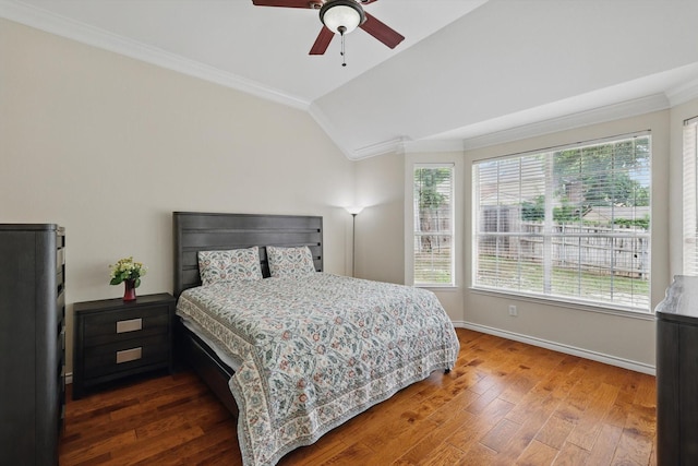 bedroom with baseboards, ornamental molding, and hardwood / wood-style flooring