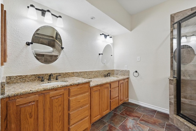 full bathroom with a sink, baseboards, a shower stall, and double vanity