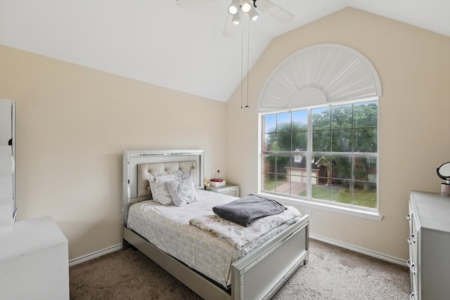 bedroom with baseboards, ceiling fan, vaulted ceiling, and light carpet