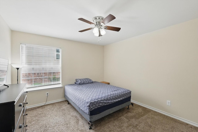 bedroom with baseboards, ceiling fan, and carpet flooring