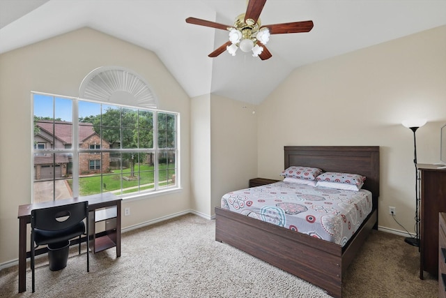 bedroom with carpet flooring, vaulted ceiling, and multiple windows