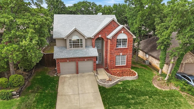 traditional-style home featuring driveway, brick siding, a front lawn, an attached garage, and a shingled roof