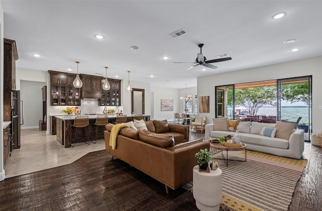 living room with recessed lighting and ceiling fan
