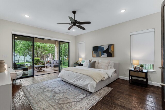 bedroom with recessed lighting, wood finished floors, multiple windows, and access to exterior