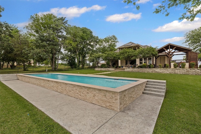 view of swimming pool with a fenced in pool, fence, and a lawn