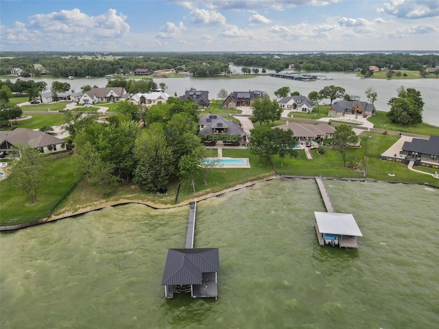bird's eye view featuring a water view and a residential view