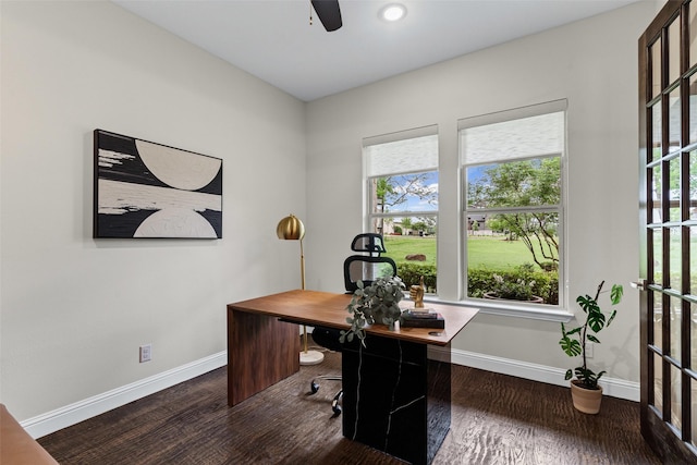home office with baseboards, ceiling fan, and wood finished floors
