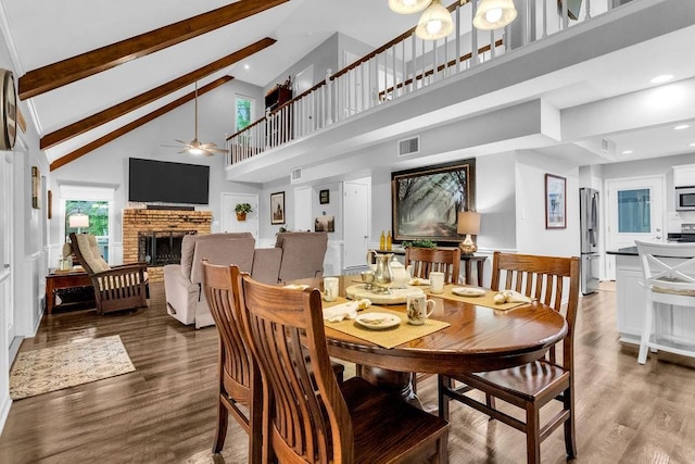 552 E Hideaway Ln, Hideaway, TX 75771 - dining room with ceiling fan, visible vents, wood finished floors, beam ceiling, and high vaulted ceiling