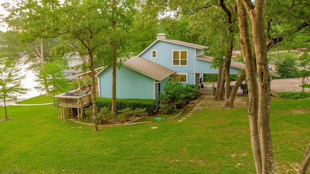 552 E Hideaway Ln, Hideaway, TX 75771 - rear view of house with a shingled roof, a chimney, a yard, and a deck