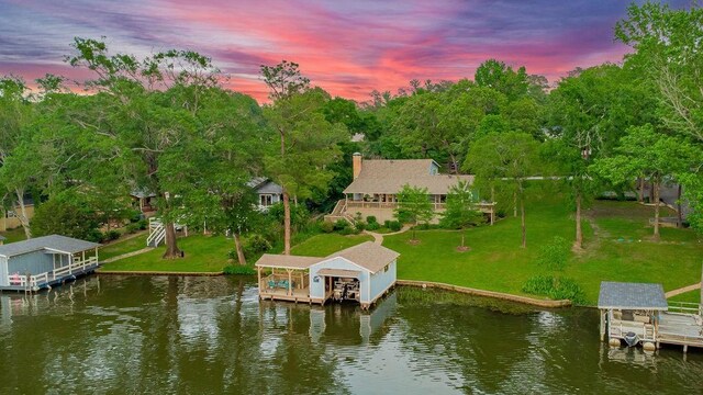 552 E Hideaway Ln, Hideaway, TX 75771 - dock area with a lawn, boat lift, and a water view