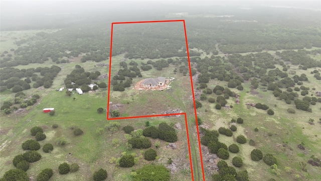 birds eye view of property featuring a rural view