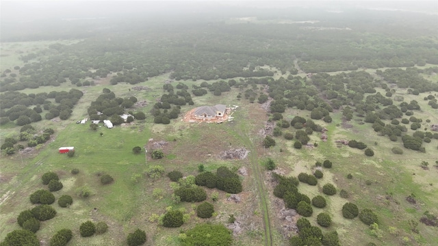 birds eye view of property with a rural view