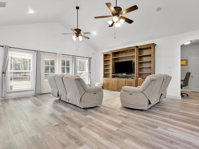 1255 Greg St, Azle, TX 76020 - living area with visible vents, ceiling fan, high vaulted ceiling, arched walkways, and light wood-style flooring