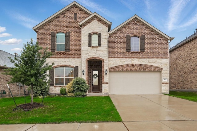1724 Eworth Dr, Little Elm, TX 75068 - french country home featuring stone siding, a front lawn, a garage, and brick siding