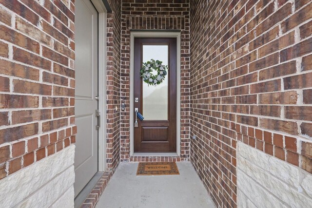1724 Eworth Dr, Little Elm, TX 75068 - traditional home featuring concrete driveway, brick siding, a front yard, and a residential view