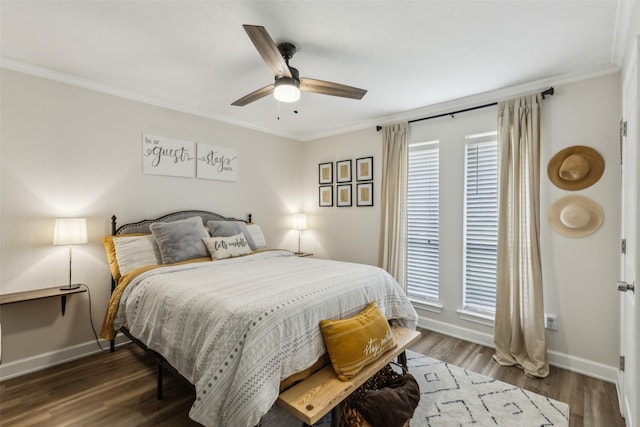 bedroom featuring baseboards, ornamental molding, a ceiling fan, and wood finished floors
