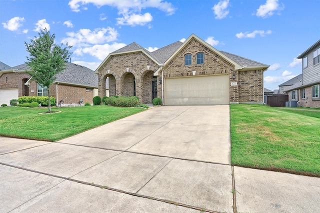 429 W N Creek Dr, Sherman, TX 75092 - french country home with brick siding, an attached garage, a front yard, and concrete driveway