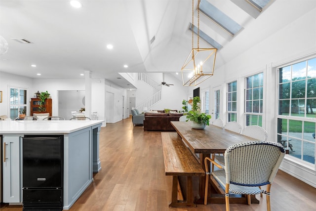 dining space featuring visible vents, recessed lighting, stairs, and light wood finished floors