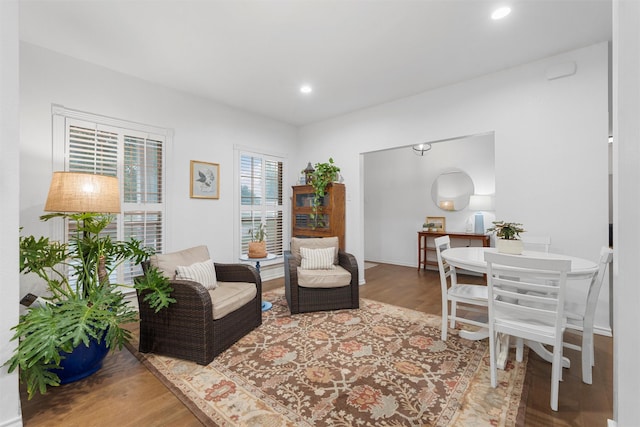 living area with recessed lighting and wood finished floors