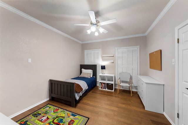 bedroom with crown molding, a ceiling fan, baseboards, and wood finished floors