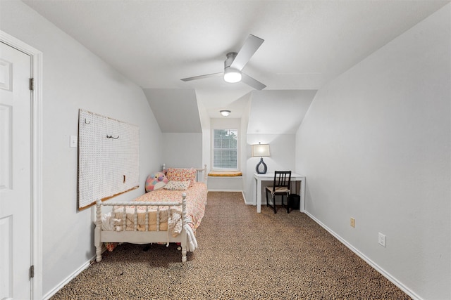 bedroom with baseboards, a ceiling fan, vaulted ceiling, and carpet flooring