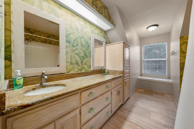 full bathroom with a sink, baseboards, double vanity, and a shower with shower curtain