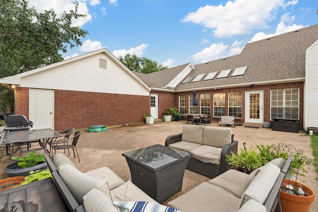view of patio featuring an outdoor living space and outdoor dining area