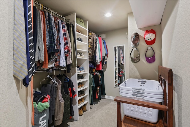 walk in closet with carpet