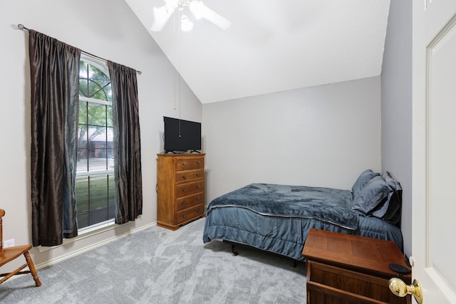bedroom featuring carpet floors, ceiling fan, baseboards, and lofted ceiling
