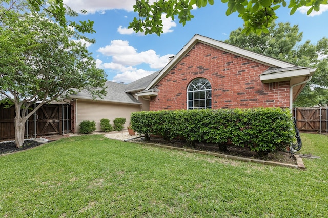 exterior space with brick siding and a gate