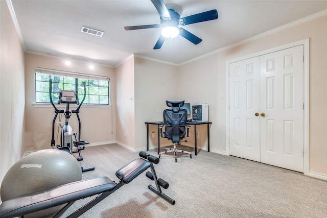 exercise room with crown molding, ceiling fan, carpet, baseboards, and visible vents