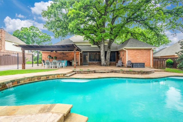 view of pool with a fenced in pool, a fenced backyard, outdoor dry bar, and a patio area